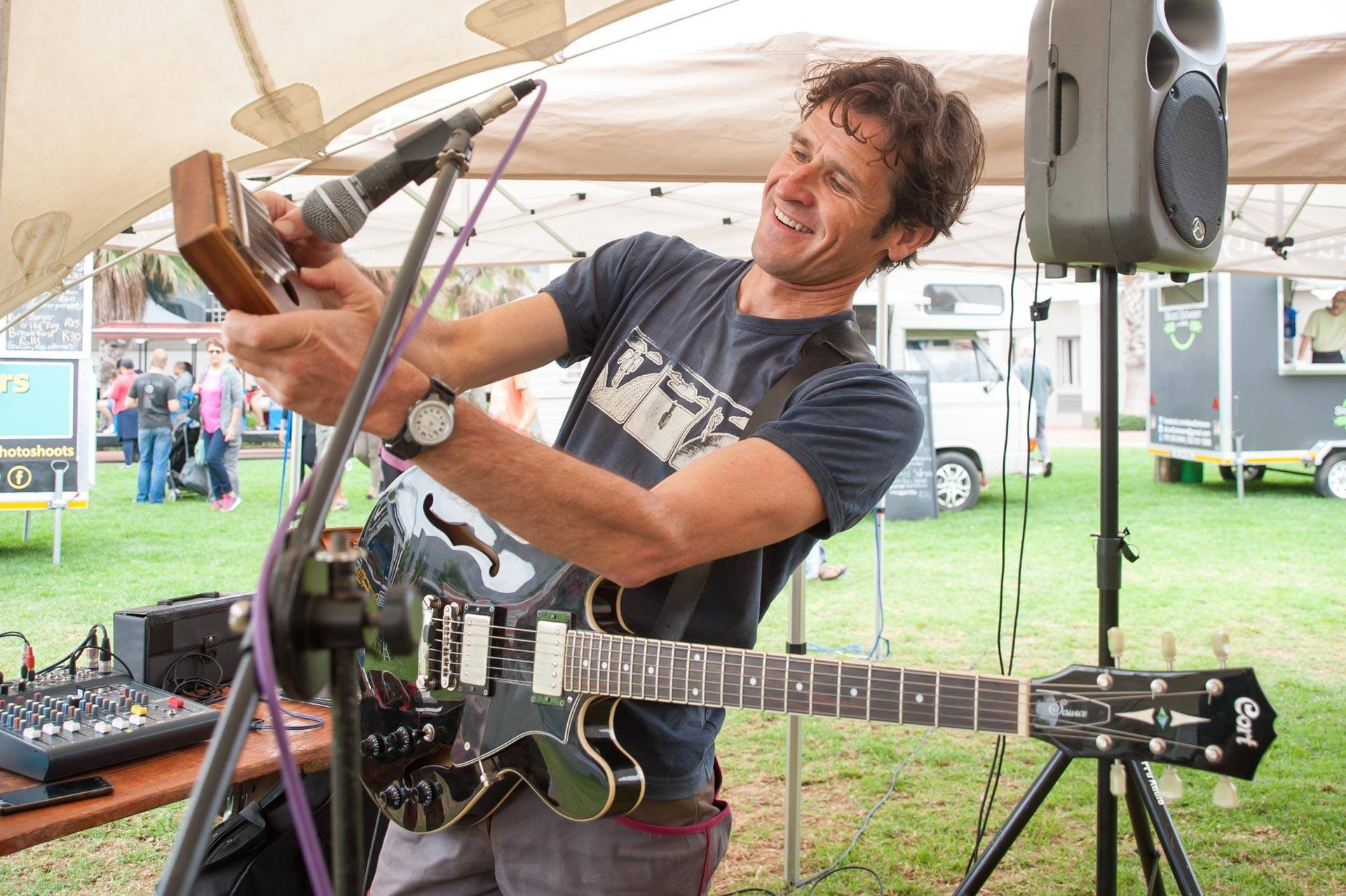 Jamie Jupiter playing guitar on stage