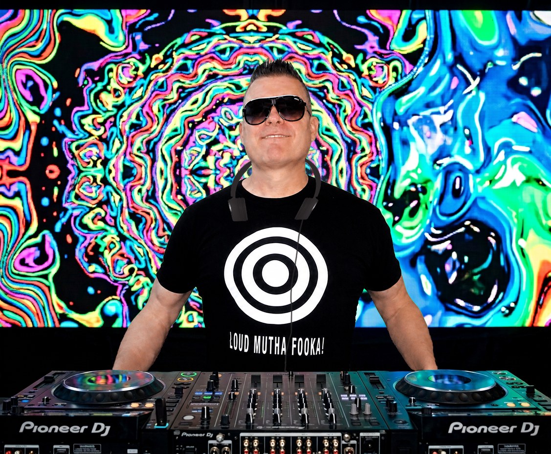 Portrait of Nick E Louder at the decks