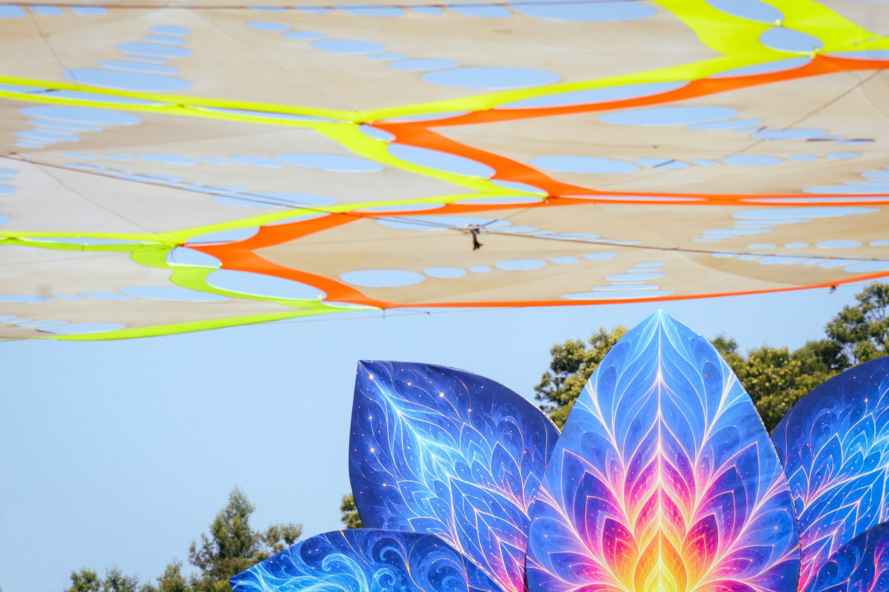 The canopy and lotus stage against a blue sky, Earthdance Cape Town 2026