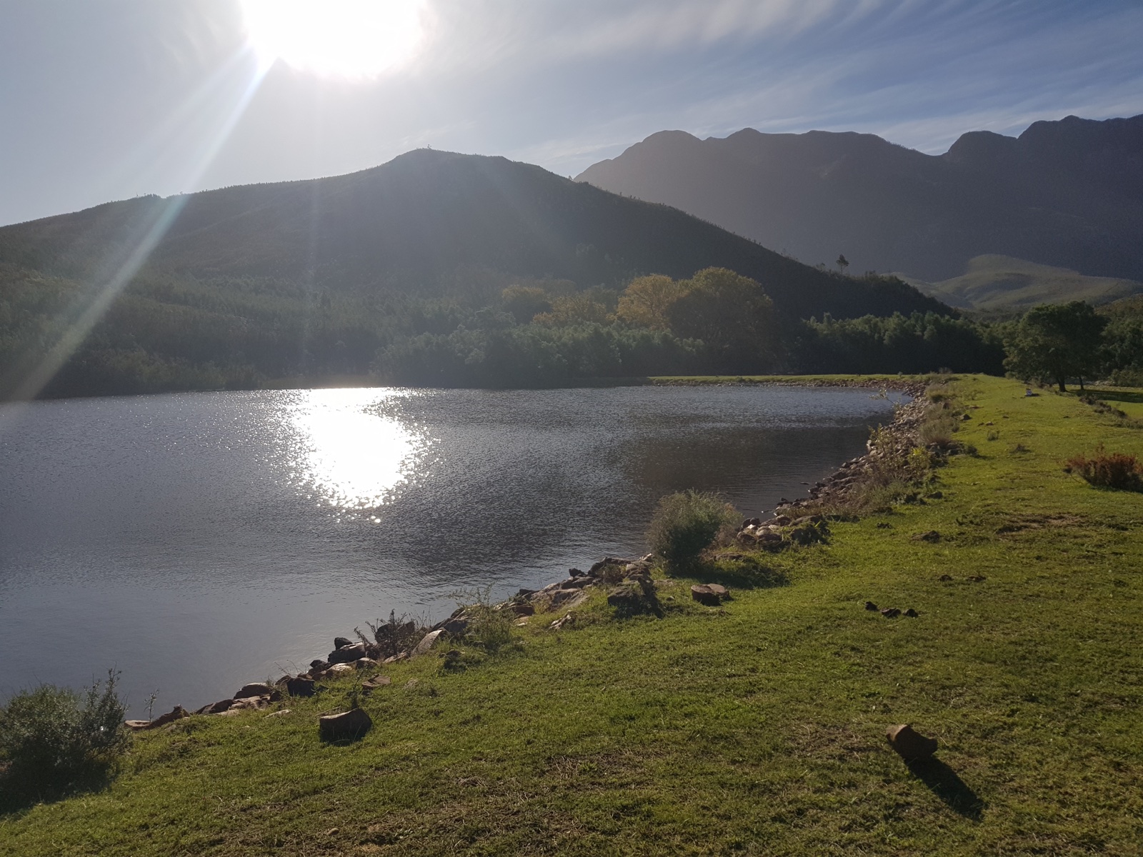 The dam and mountain landscape surrounding Morado Cottage