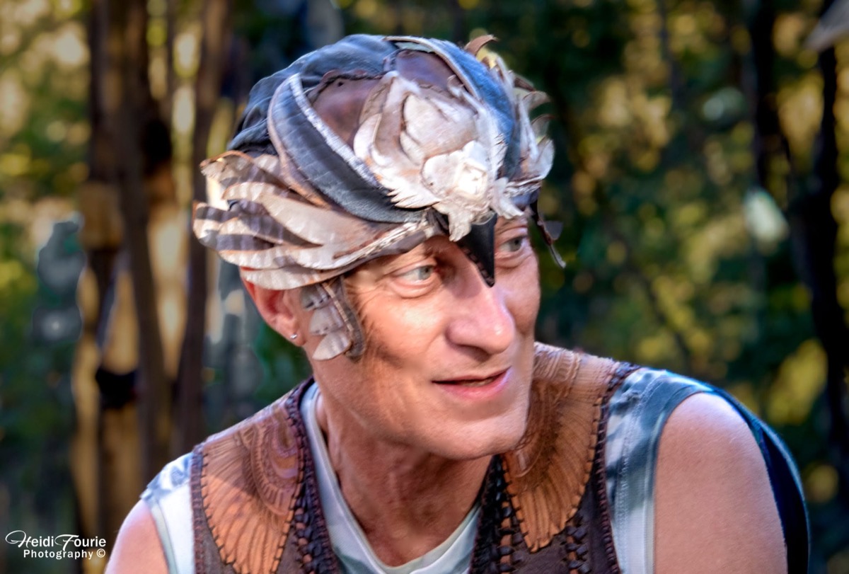 Michael "Birdman" Aldridge wearing a feathered headdress