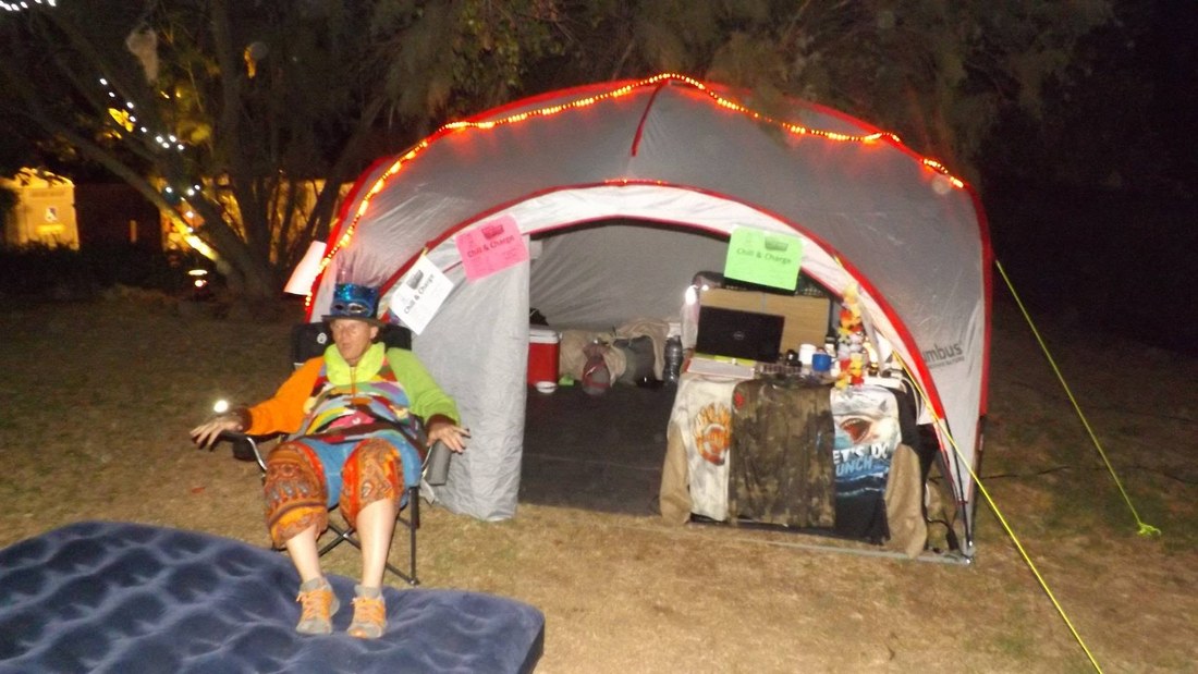 The Chill and Charge tent lit up at night