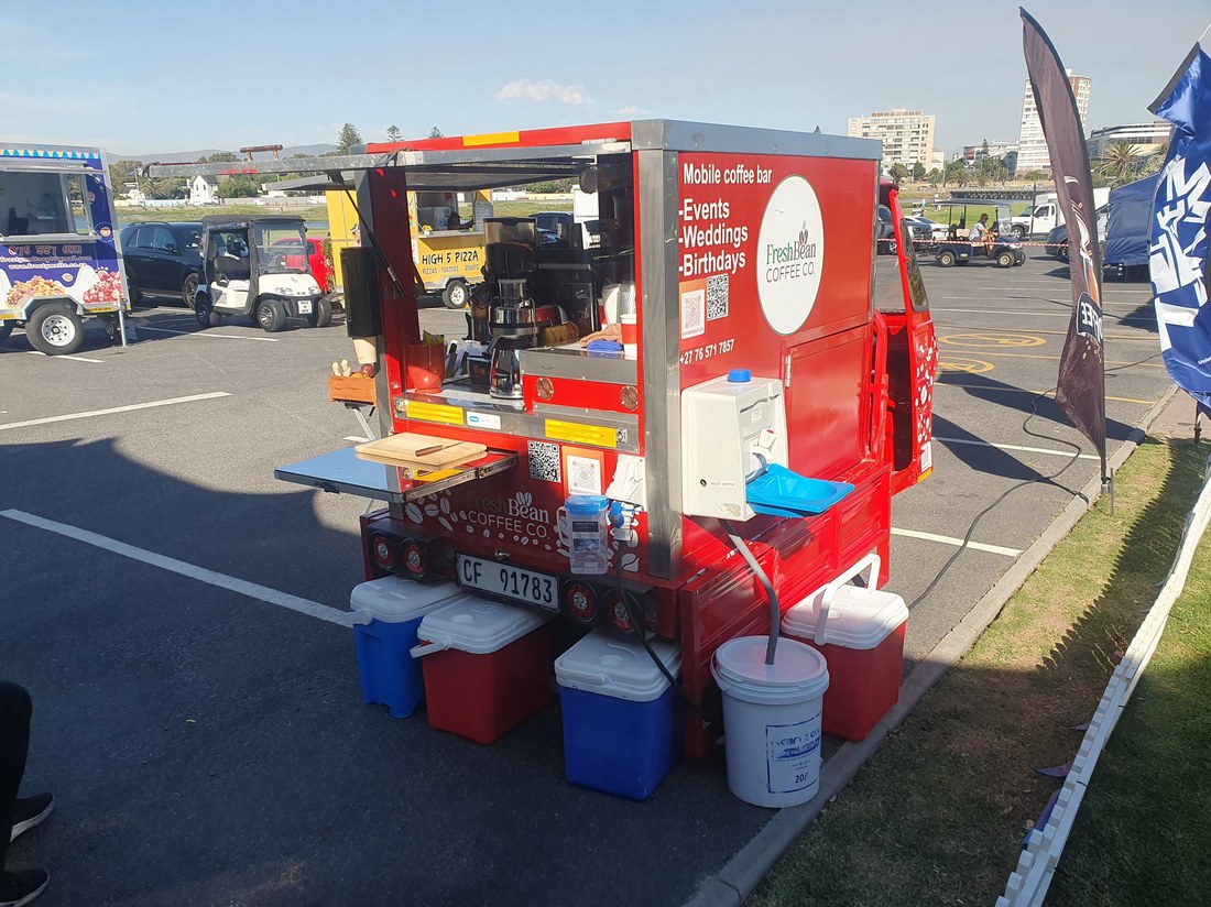 The Fresh Bean Coffee Co. mobile coffee cart, branded red with a Mobile Coffee Bar sign