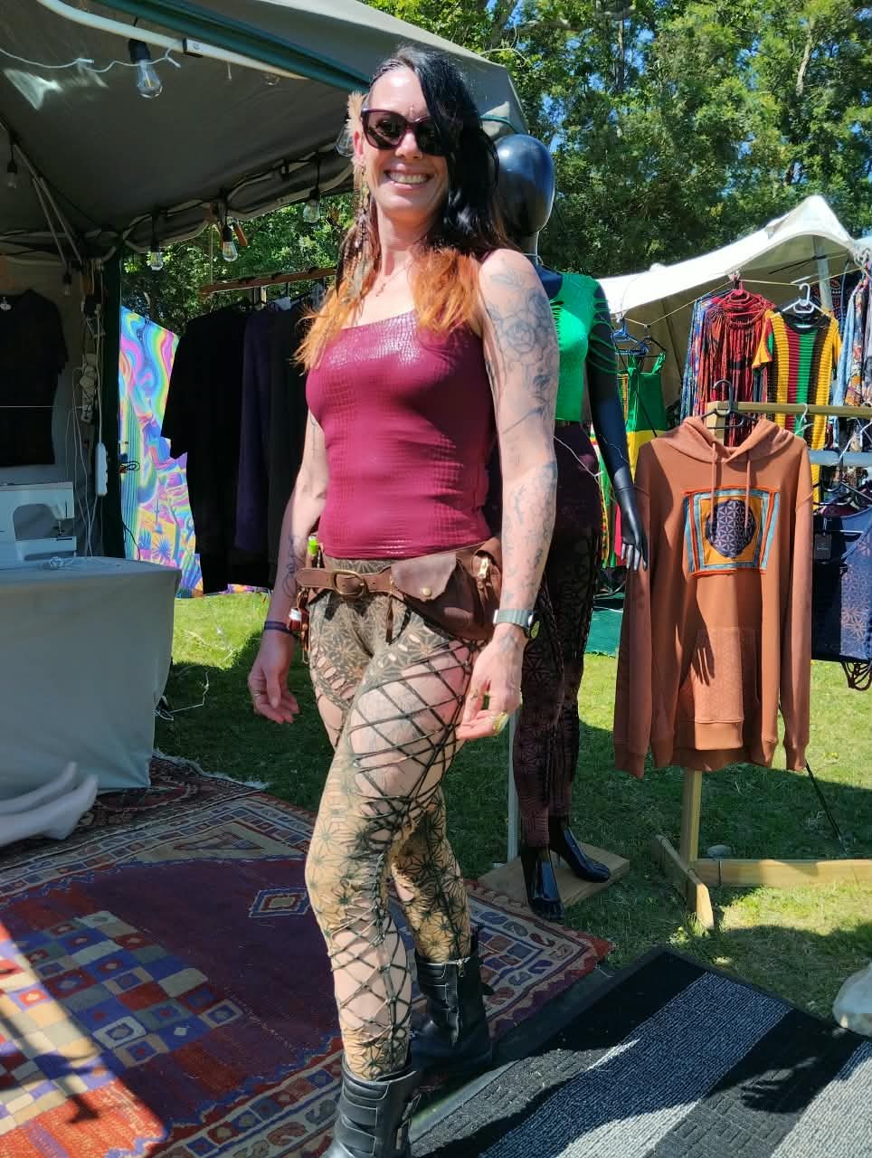 A woman in a burgundy top and laser-cut leggings in front of the GeoVinty rails