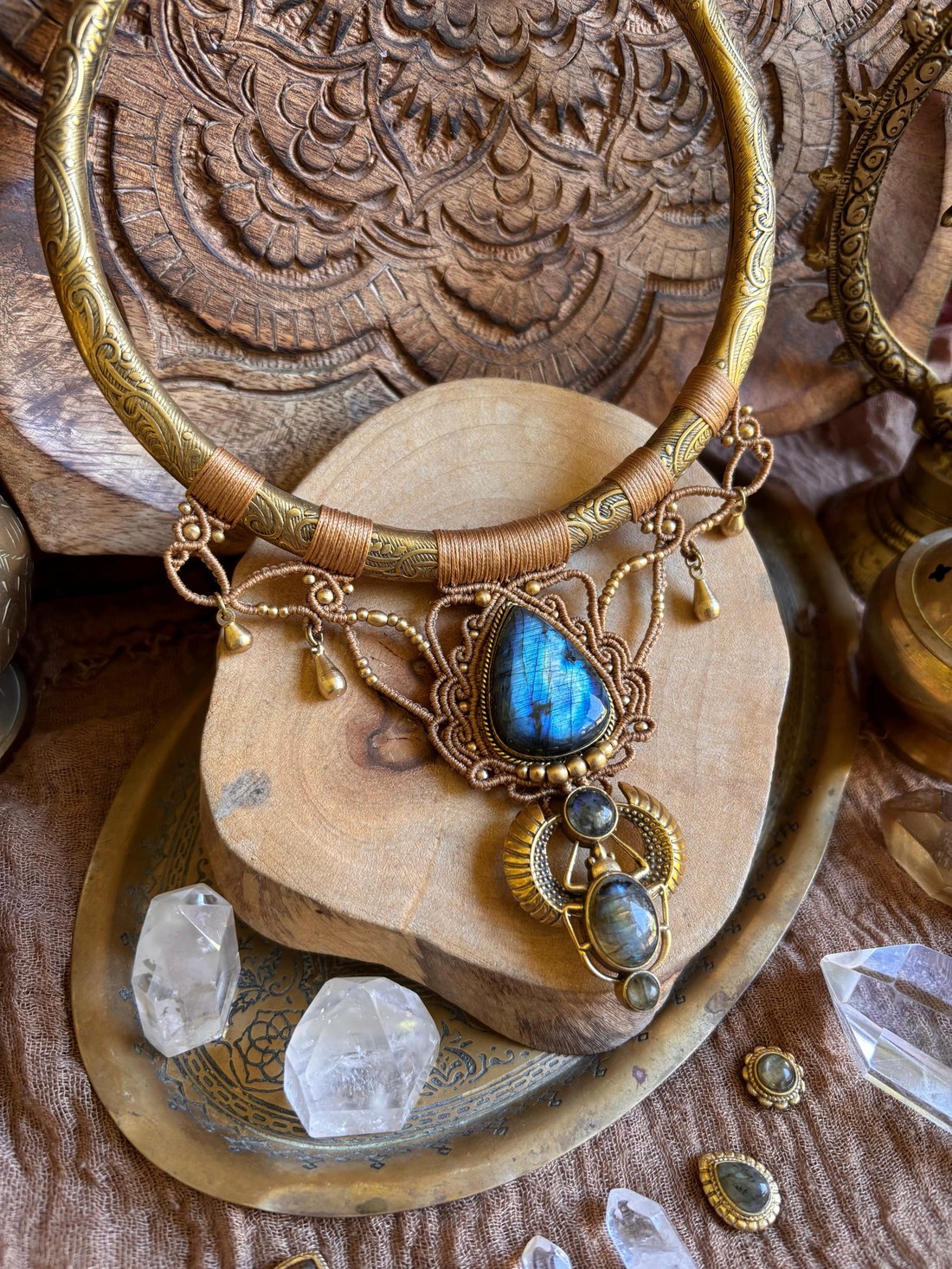 A macramé choker with a large labradorite pendant and beaded fringe