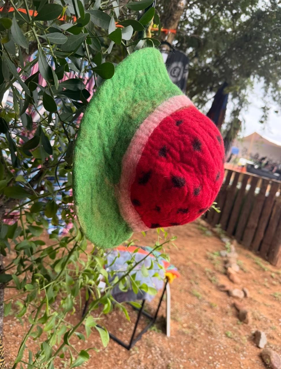 A handmade felted watermelon-slice hat