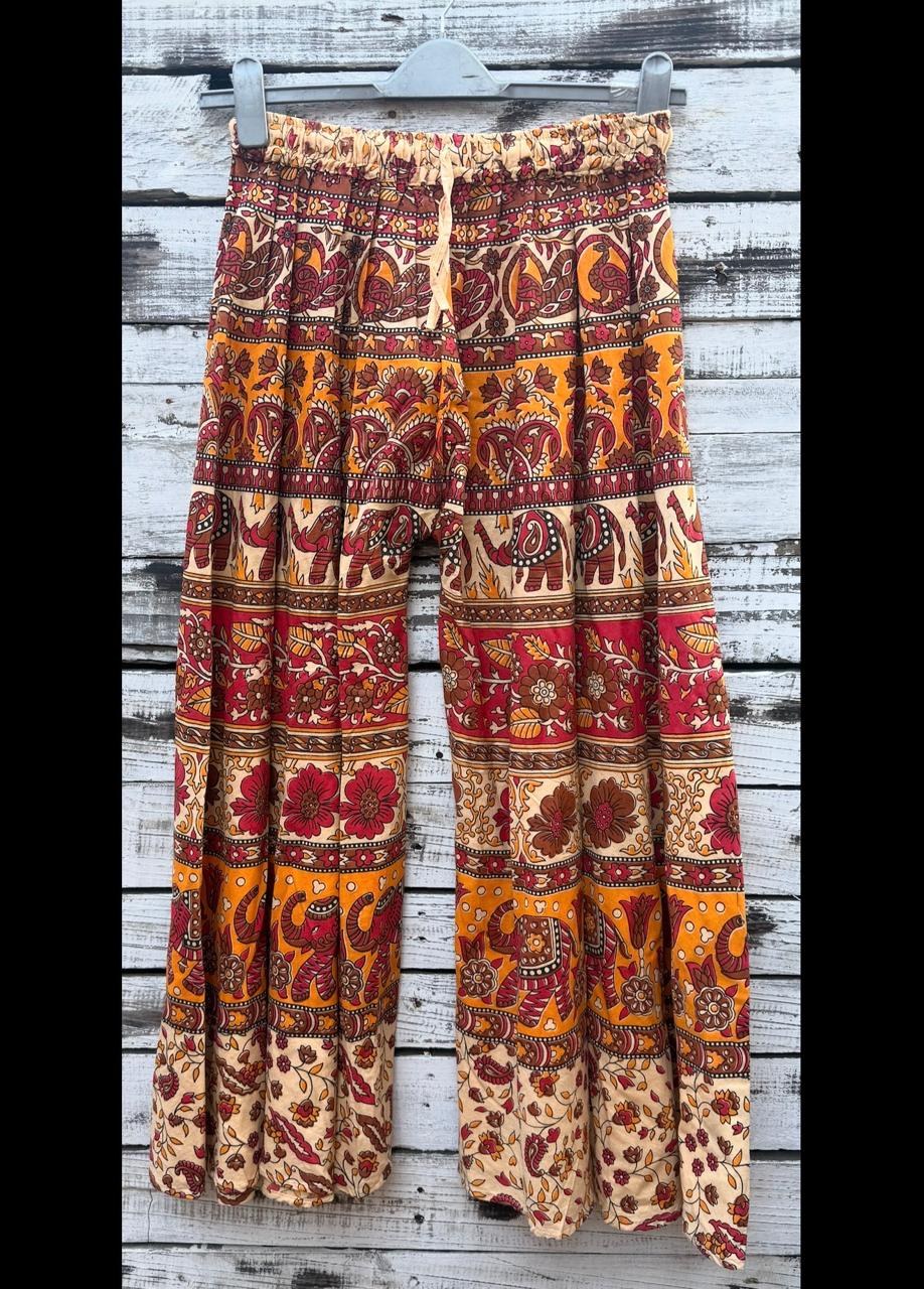 Wide-leg harem pants in a red and orange elephant print