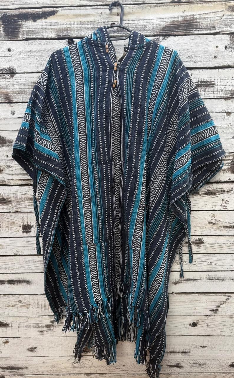 A striped hooded poncho with fringed trim